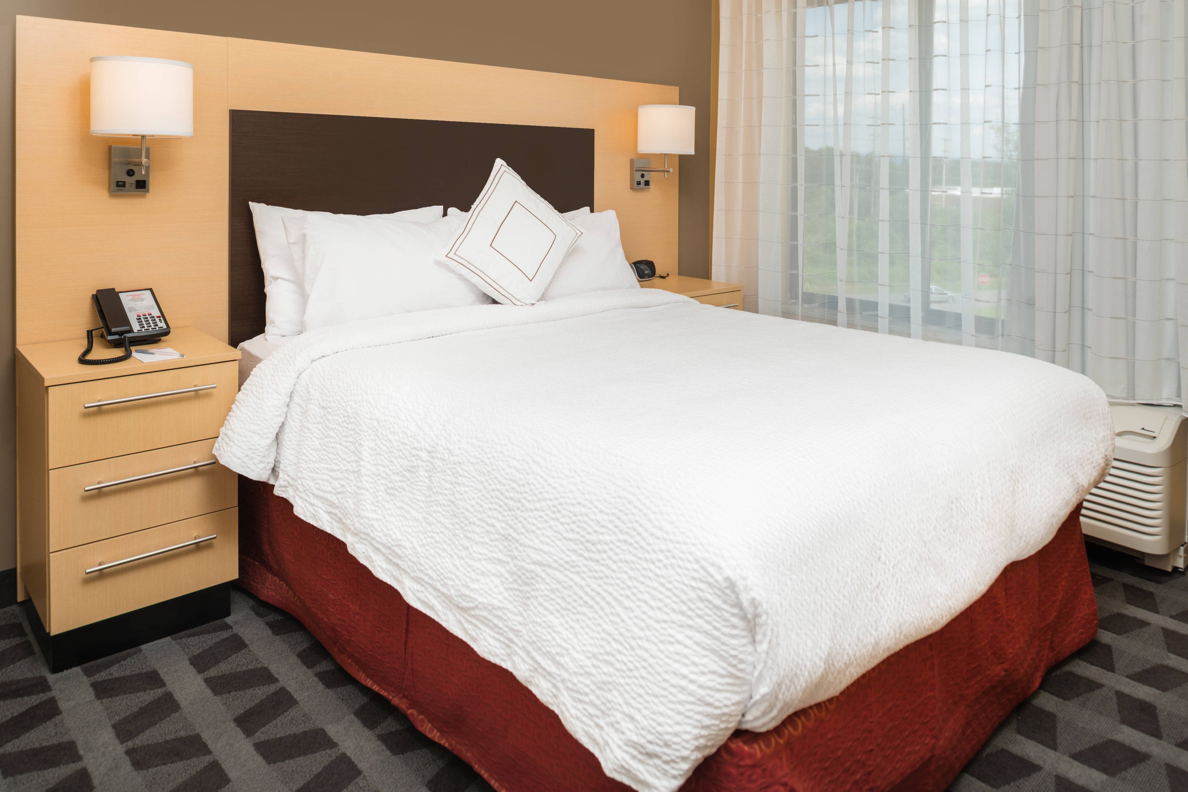 TownePlace Suites by Marriott New Hartford-guestroom-One-Bedroom Suite - Sleeping Area.jpg