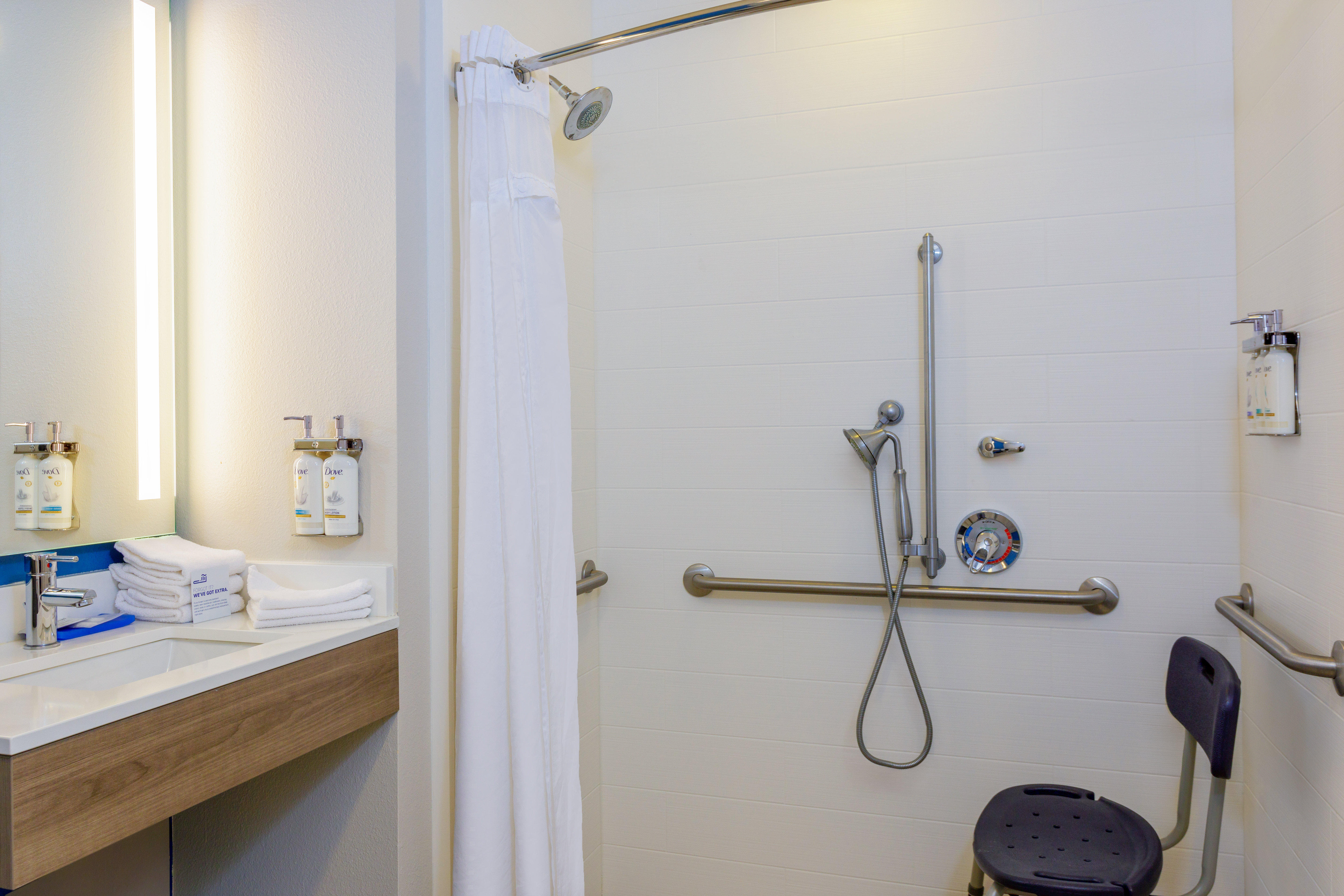HOLIDAY INN EXP STES OCOEE EAS-guestroom-Roll In Shower.jpg