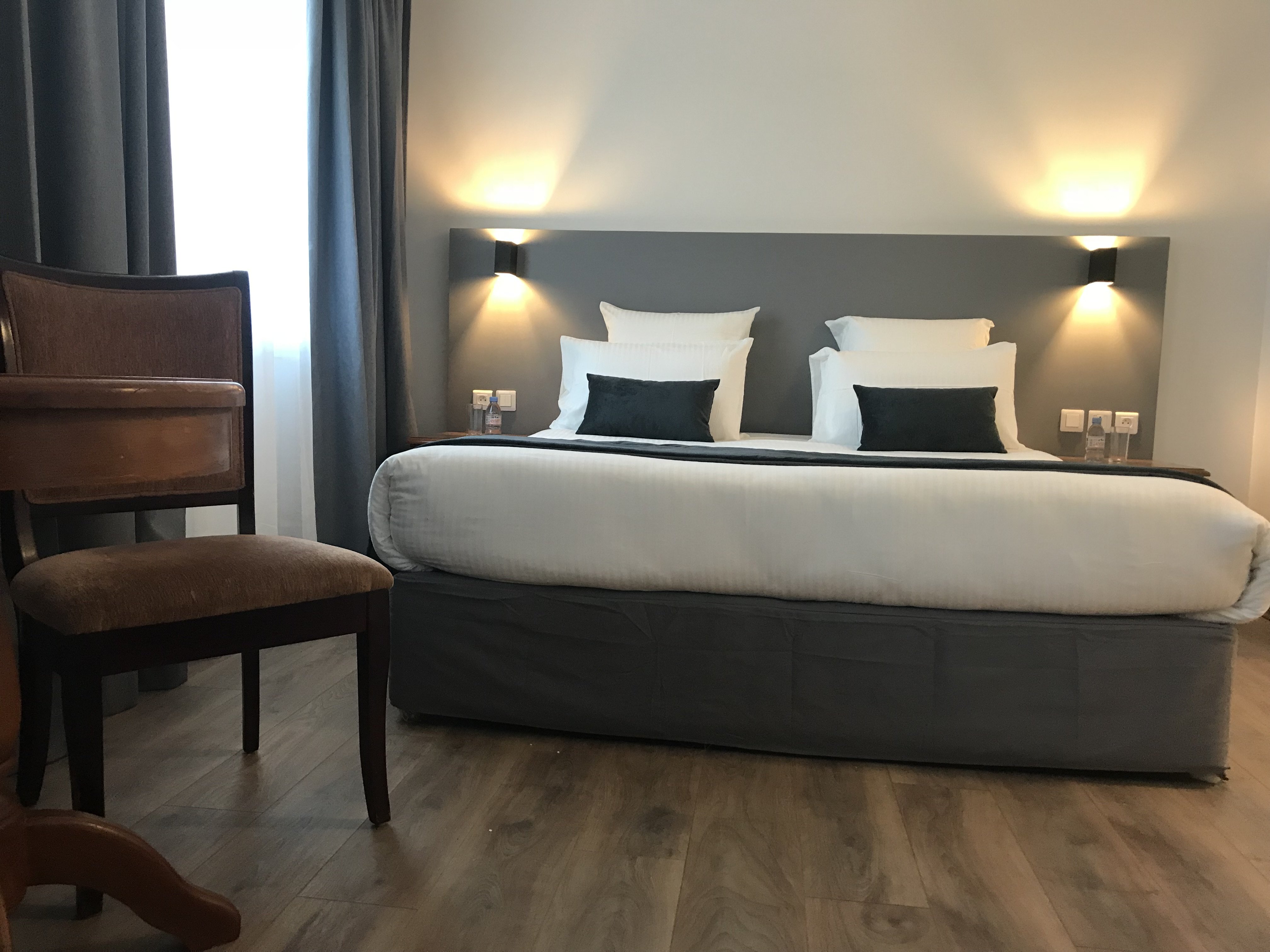 Hotel Le Bourgogne-guestroom-Deluxe Room Queen Bed.jpg