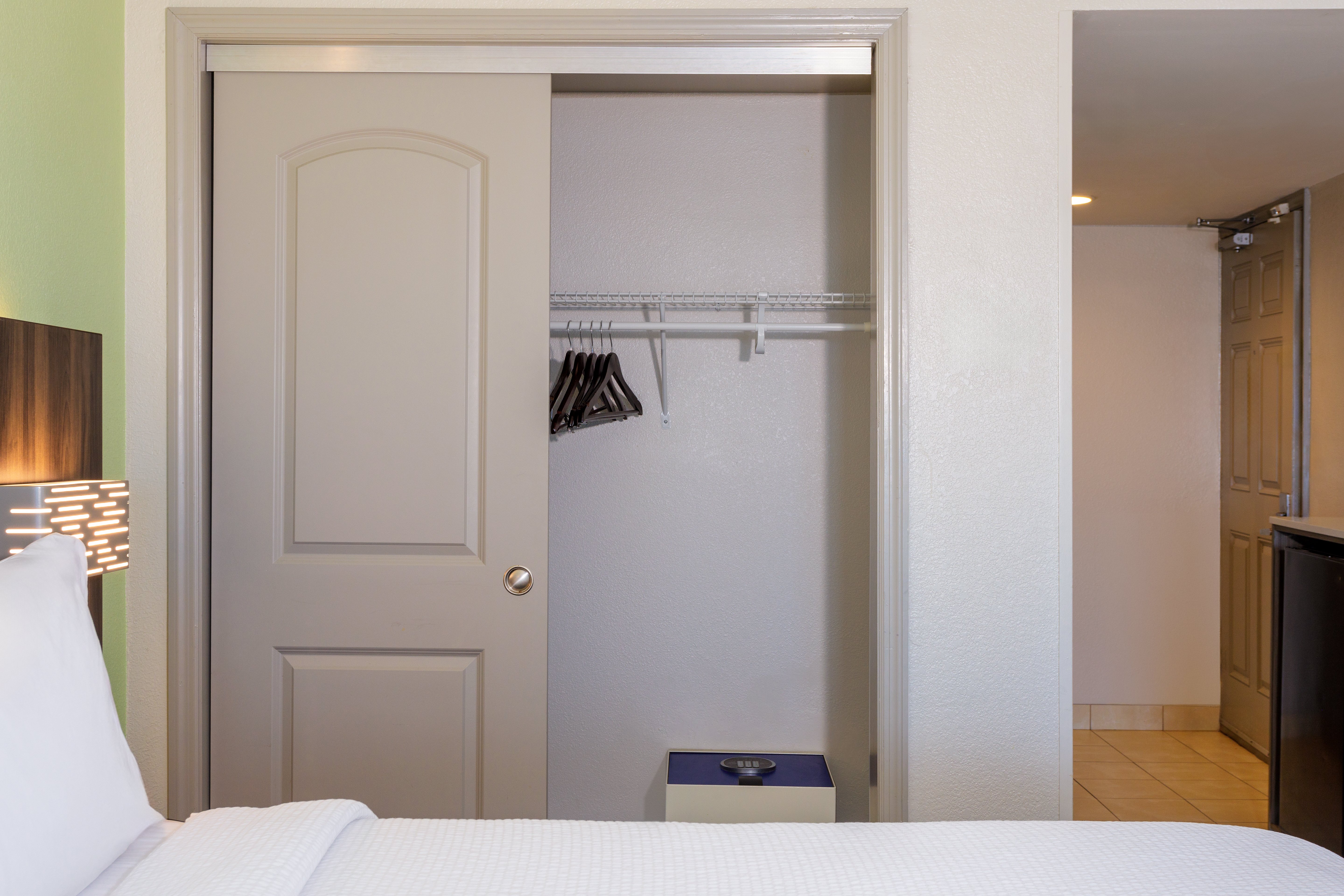 HOLIDAY INN EXP STES OCEANFRON-guestroom-1 Bedroom Suite/1 King Deluxe Closet.jpg