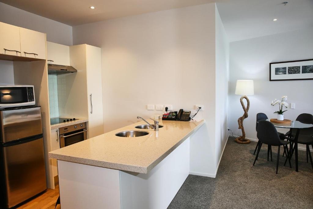 Marsden Suites Nautilus Orewa-guestroom-Orewa Suites Kitchen Area.jpg