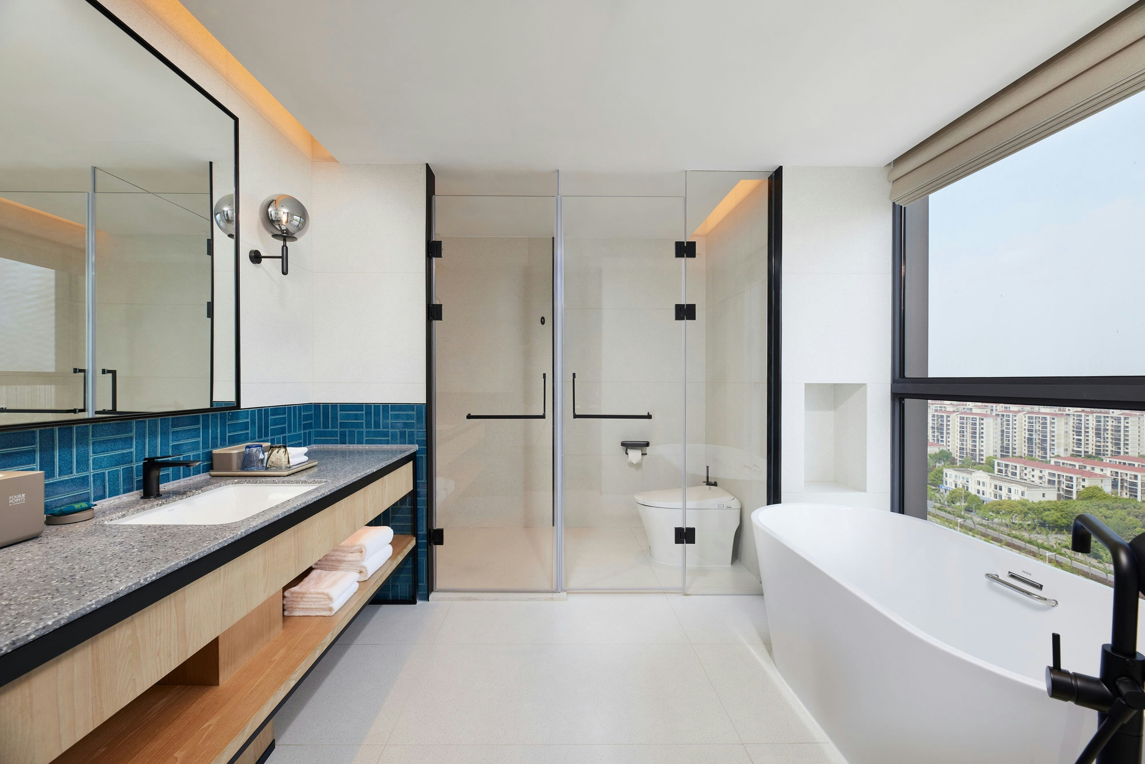 TownePlace Suites by Marriott Humble Intercontinental Airport-guestroom-Suite bathroom with separate tub and shower.jpg