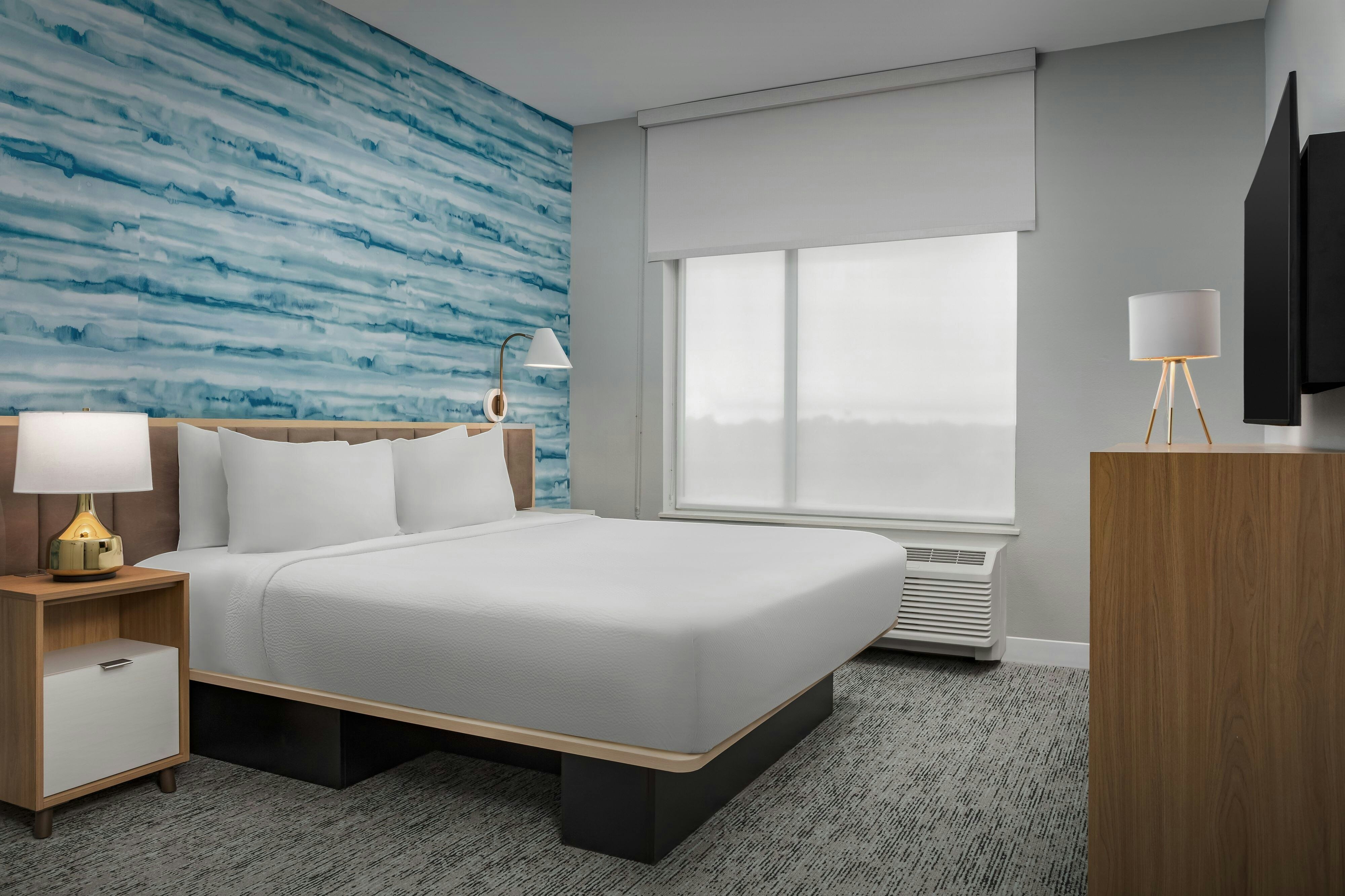 TownePlace Suites by Marriott Forney-guestroom-King Bed and Dresser.jpg