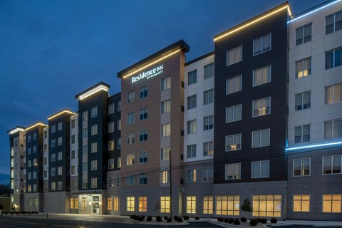 Our hotel exterior glistens against the evening sk