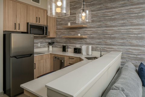 King Suite featuring full-size kitchen appliances.