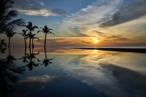 Thanda Island Sunset Pool and Palm Trees Hywell Waters