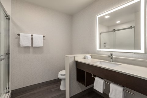 Guest bathroom with vanity and shower in downtown Houston.