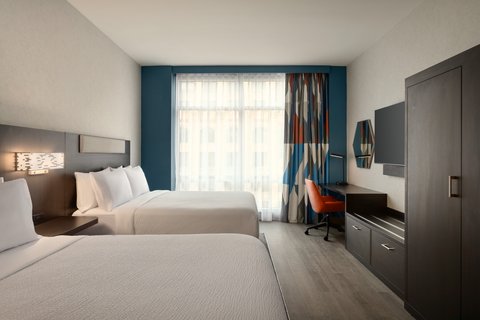 Two Queen Standard room with desk in downtown Houston.
