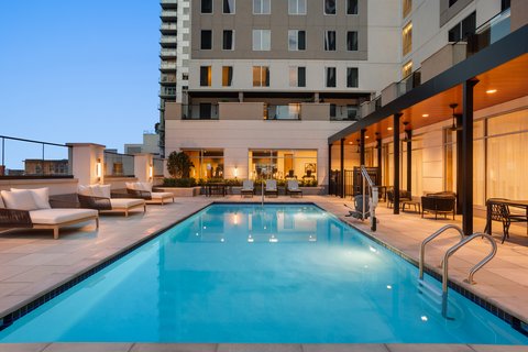 Relax by our outdoor heated pool in Houston.