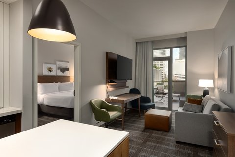 Enjoy extra space and balcony views in your suite.