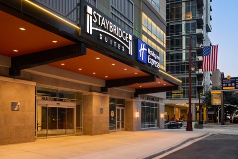 Downtown Houston hotel exterior near the city skyline.