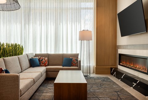 Lobby lounge with fireplace at our downtown Houston hotel.