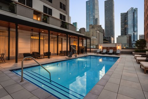 Relax by the outdoor pool in our downtown Houston.