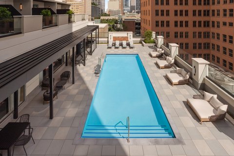 Downtown Houston outdoor pool with lounge seating.