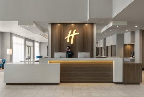 Friendly front desk service at Holiday Inn Commerce City.