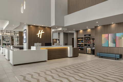 Front desk and onsite market at Holiday Inn Commerce City.