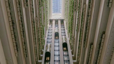 The view of the atrium and lift capsules from the hotel lobby