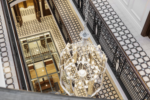 Look down and discover the details woven through our atrium