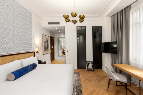 Enjoy a spacious room with a writing desk and comfortable bed
