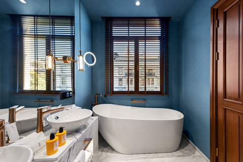 Soak in a freestanding bath beneath warm Istanbul light