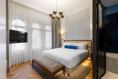 Enjoy suite living with soaring arched windows and natural light