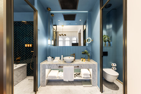 Your suite opens onto a marble ensuite with premium amenities