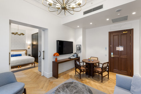 Enjoy a light-filled living area with a sofa, TV and Istanbul view