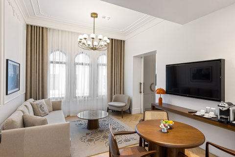 Unwind in a grand living room with soaring arched windows