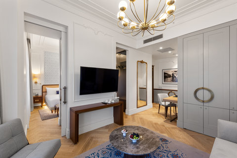 Settle into suite living with a full-length mirror, sofas and more