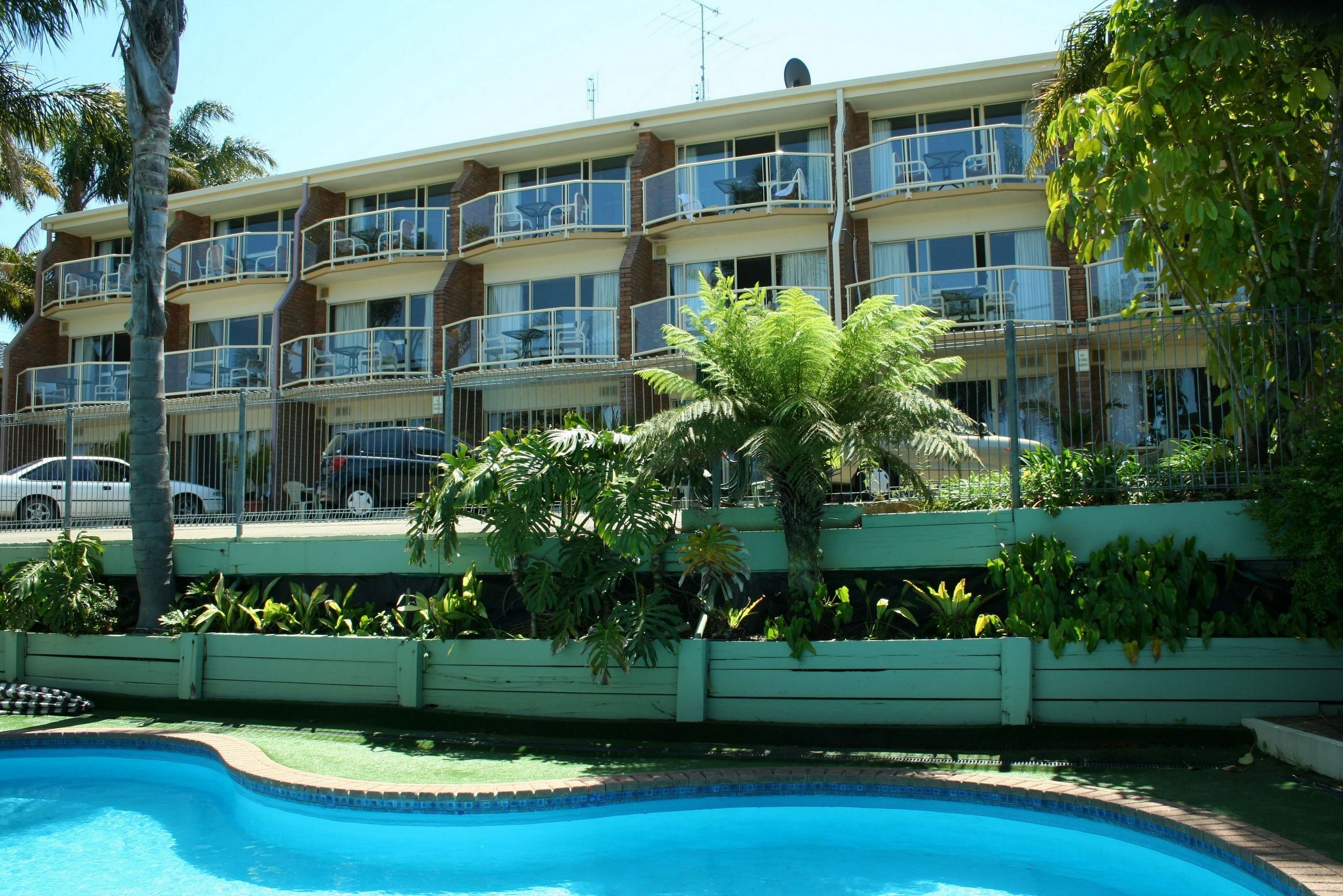 SAPPHIRE WATERS MOTOR INN-guestroom-looking from pool to balcony suite.jpg