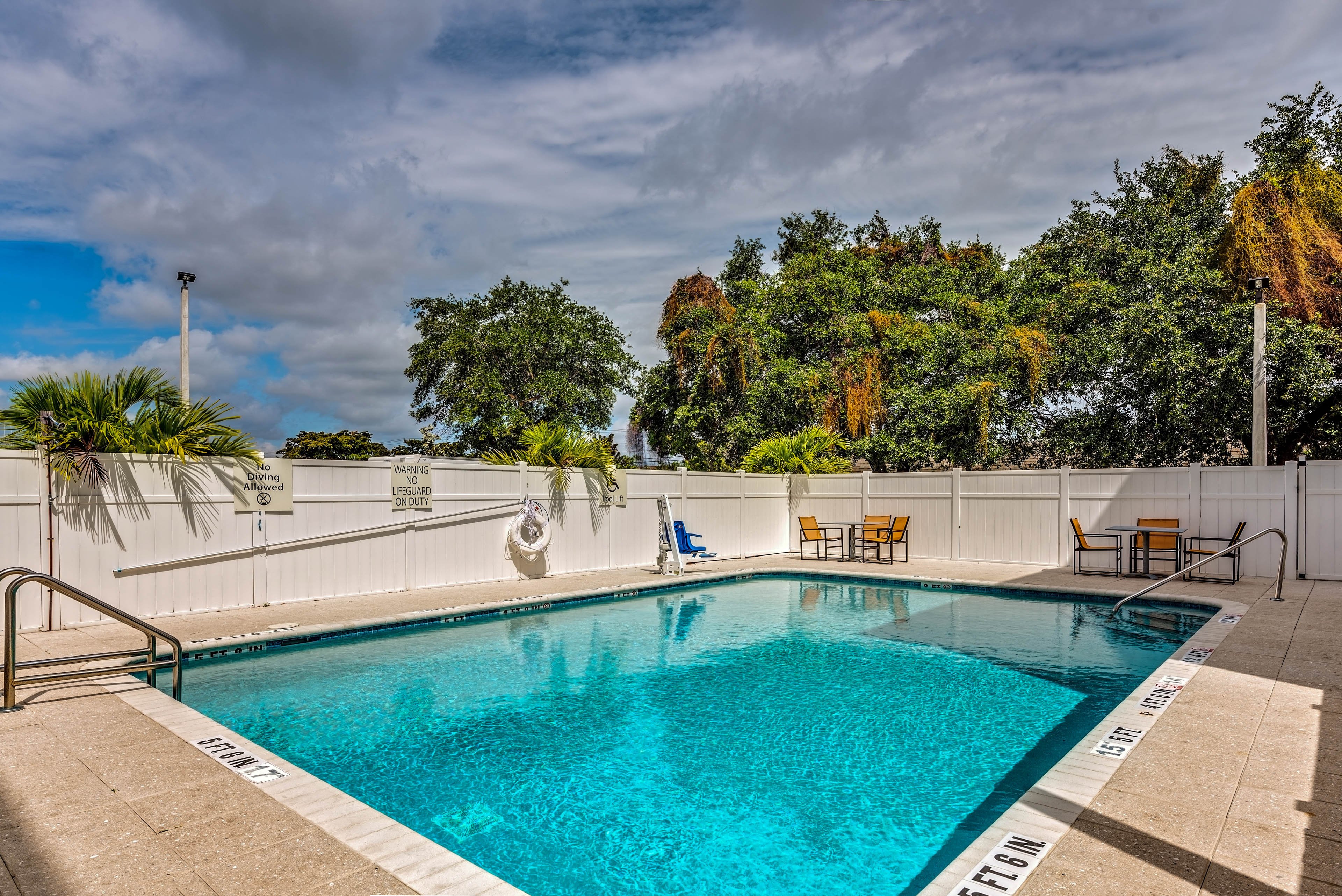 HOLIDAY INN EXP STES BOYNTON W BY I-guestroom-Outdoor swimming pool, Holiday Inn Express & Suites Boynton Beach.jpg