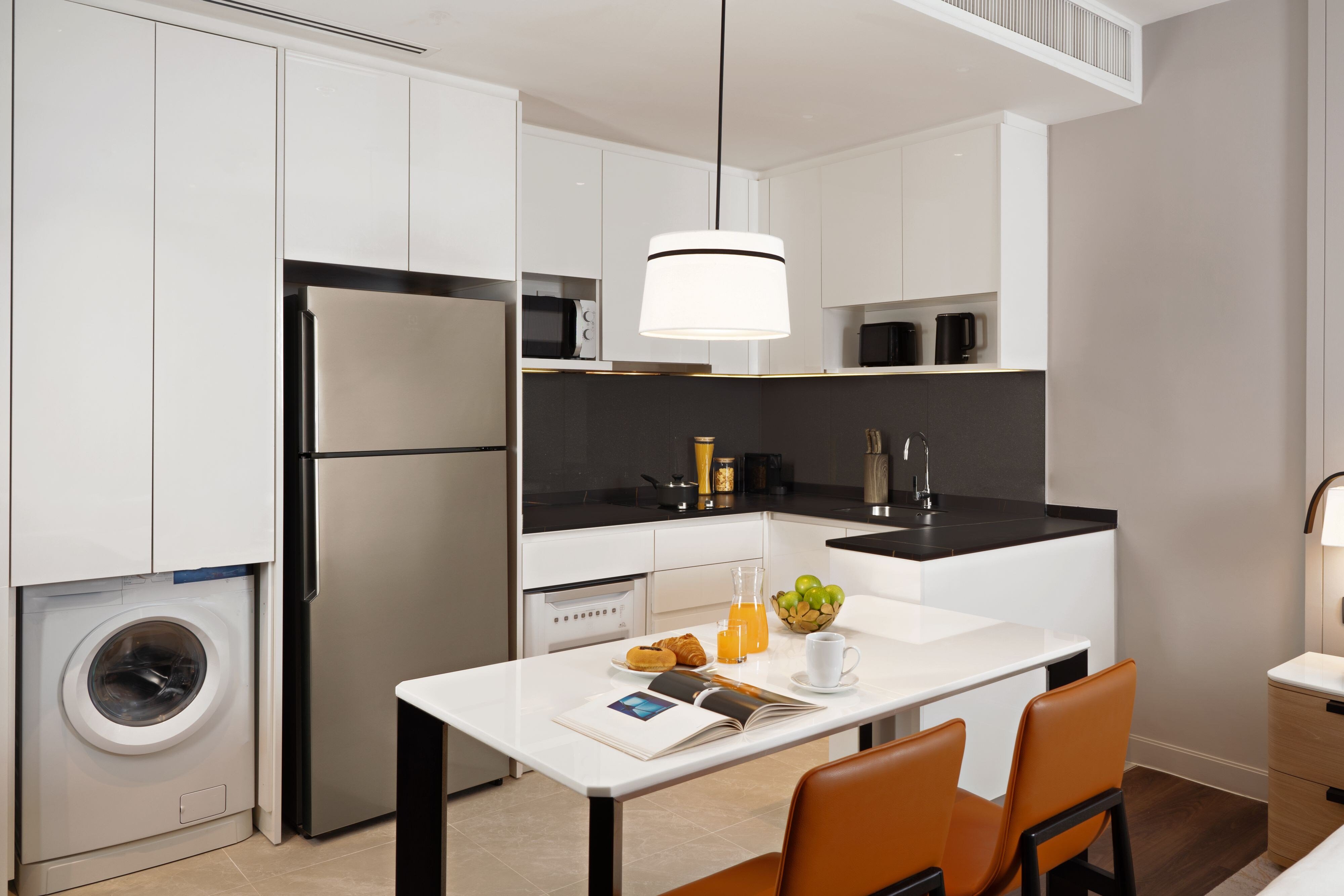 Marriott Executive Apartments Bangkok Sukhumvit 101-guestroom-Suite Kitchen and Dining Area.jpg