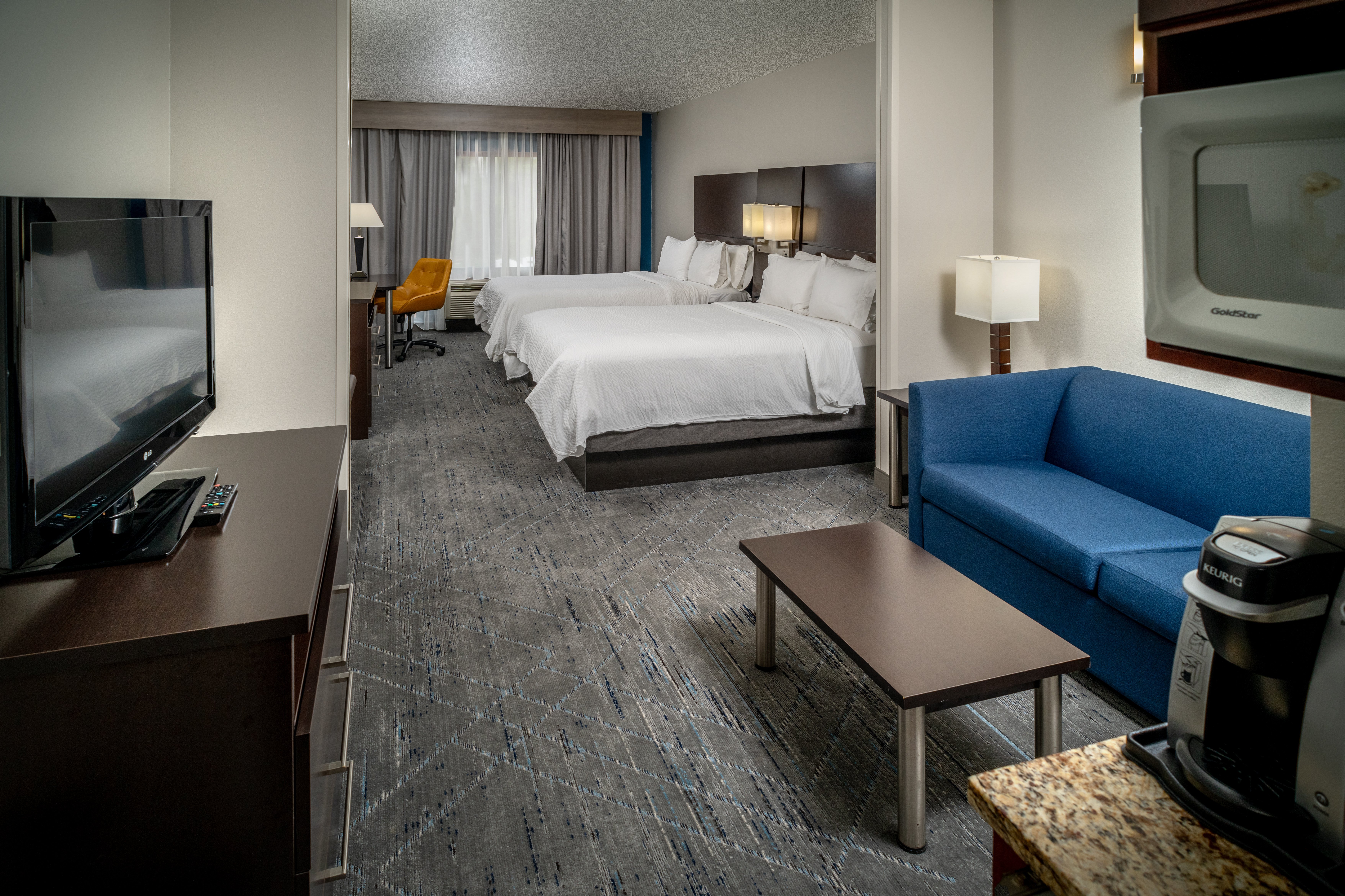HOLIDAY INN EXP STES CROSS LANE BY-guestroom-Suite.jpg