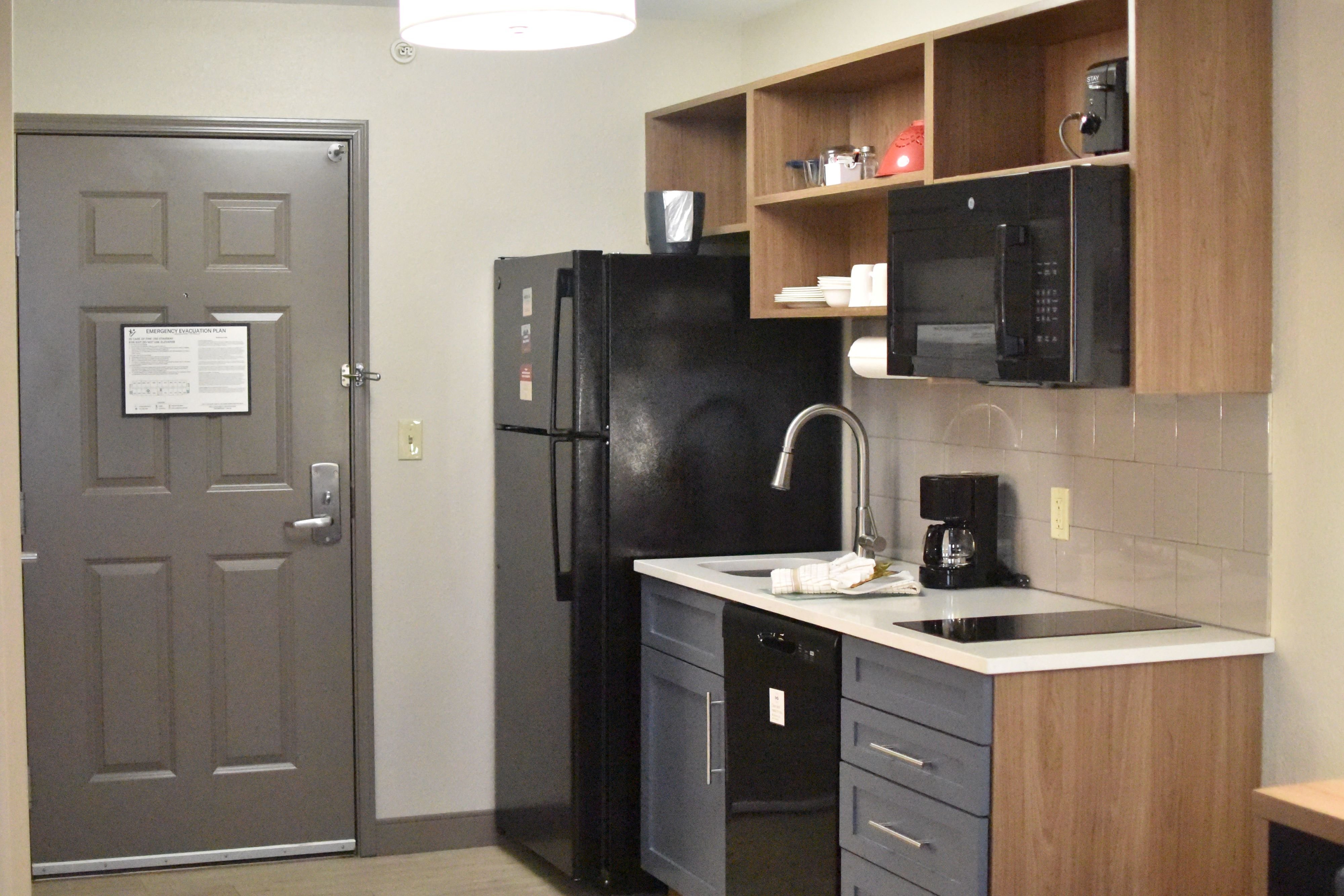 CANDLEWOOD SUITES UNIV OF AR BY IHG-guestroom-Refrigerator, Dishwasher, Microwave & Dishwasher in Every Room .jpg