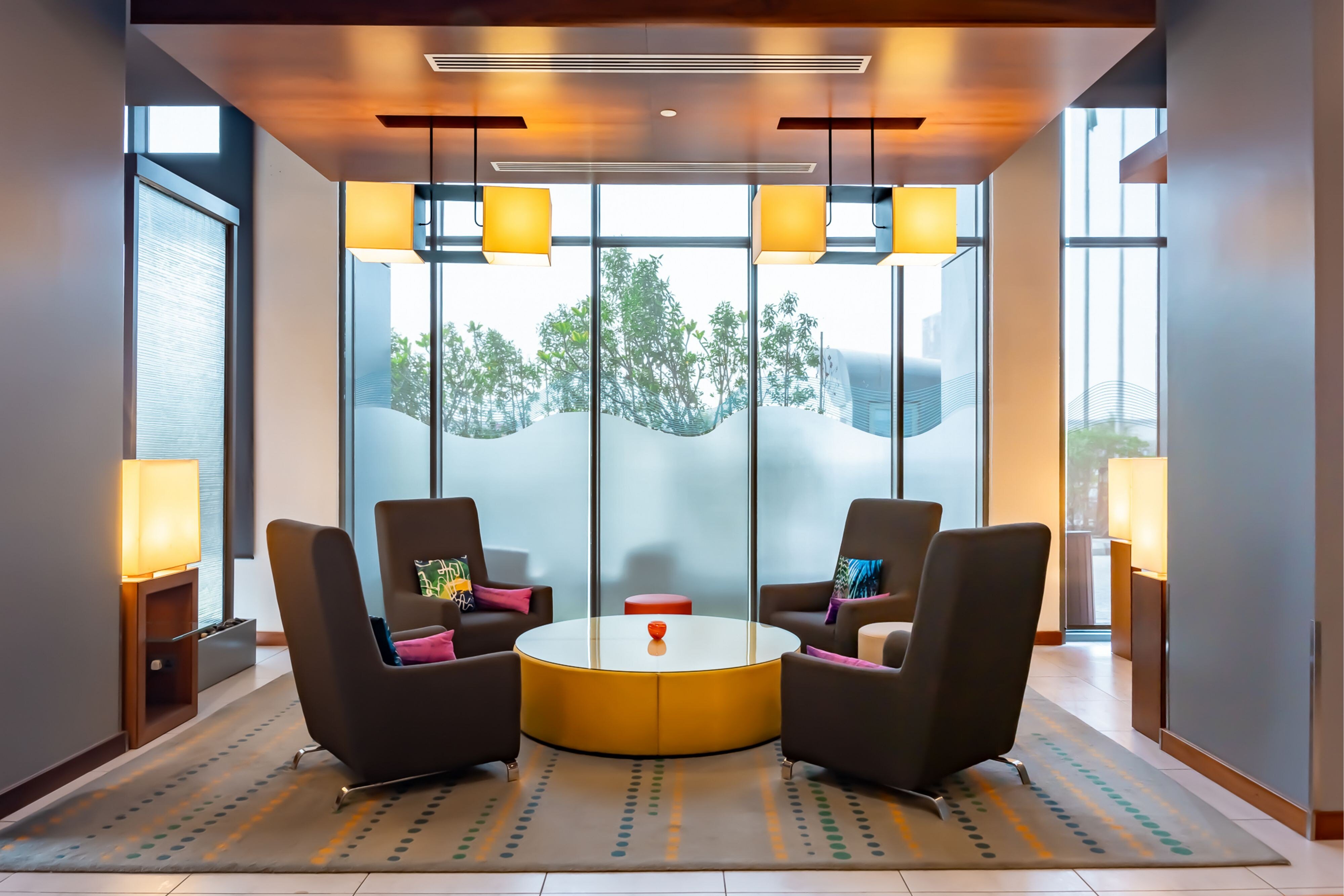 Aloft Dhahran-guestroom-Sitting area near exit.jpg