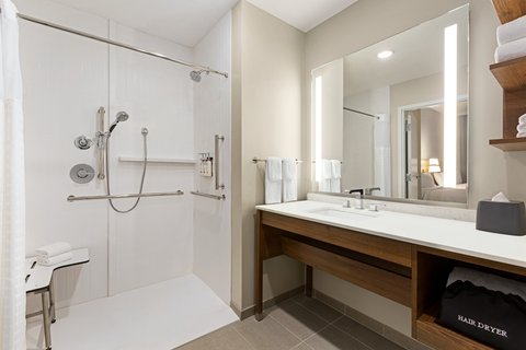 Recharge in our spacious guest bathroom with an ADA roll-in shower