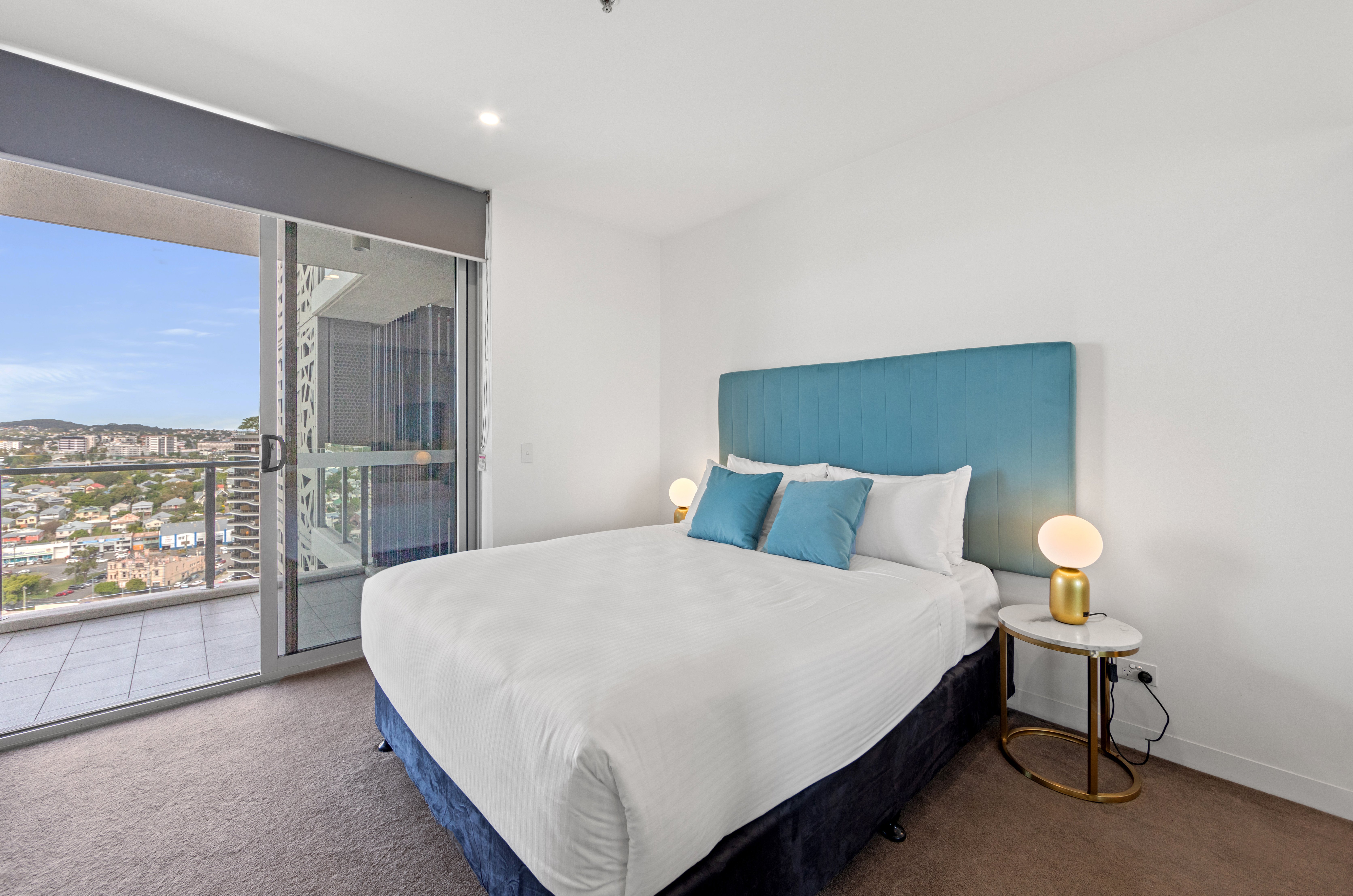 Trafalgar Lane Apartments by C-guestroom-1 Bedroom Bed.jpg