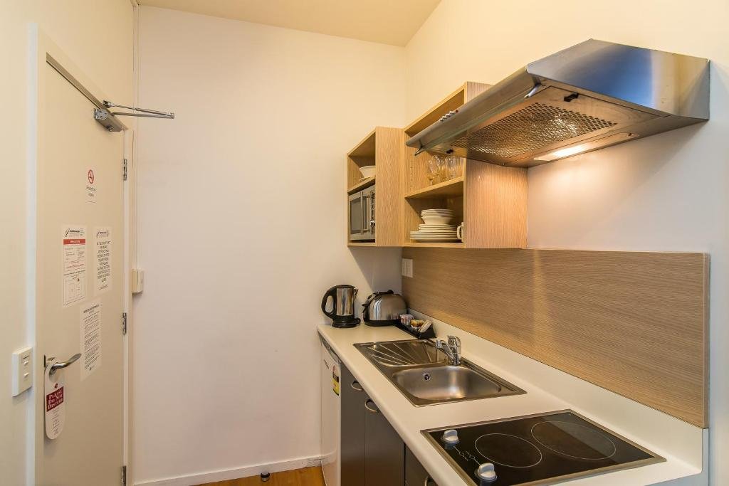 Gilmer Apartment Hotel-guestroom-Bedroom Apartment Kitchen.jpg