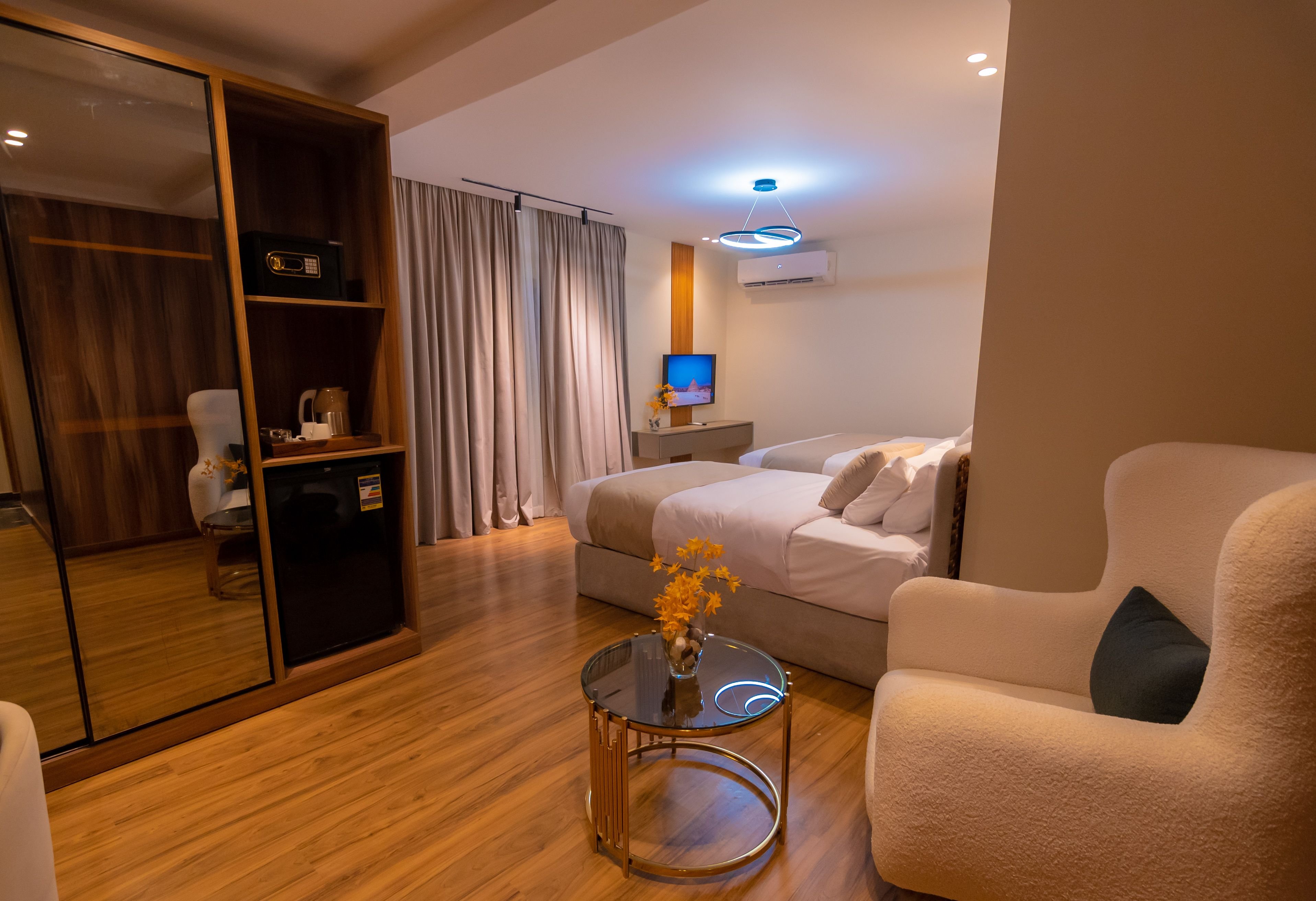SPIRE WEST HOTEL-guestroom-Junior Suite Pyramids View.jpg