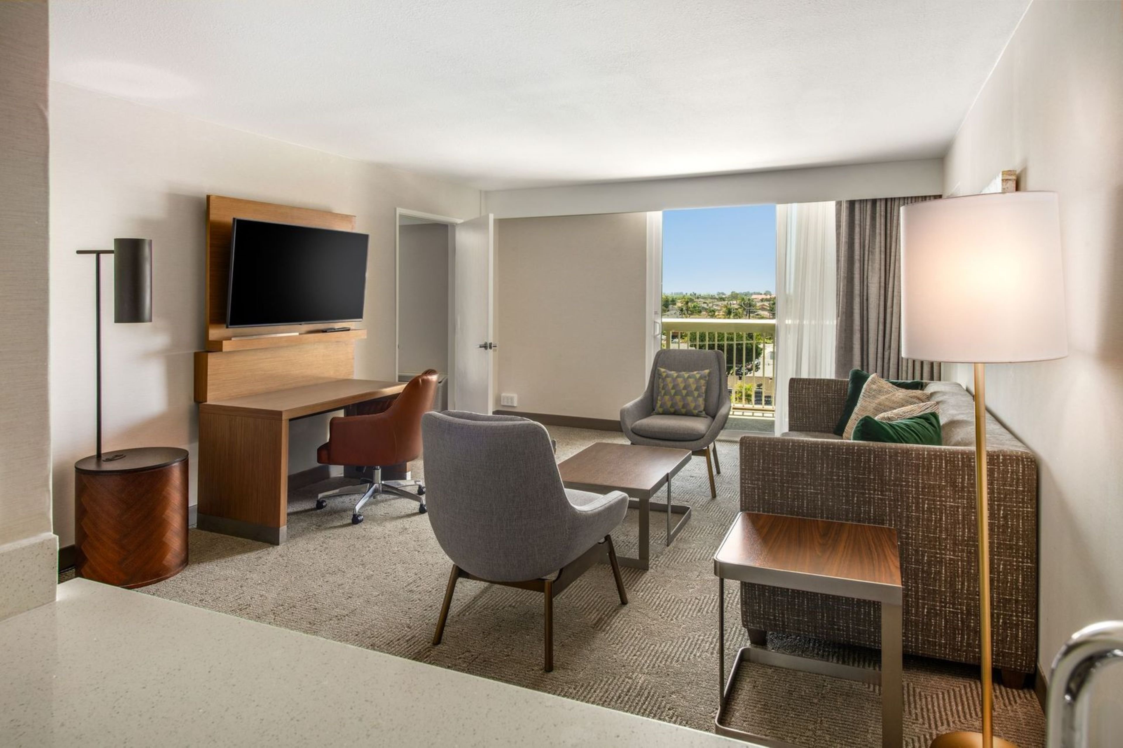 HOLIDAY INN OXNARD - VENTURA BY IHG-guestroom-Enjoy our one bedroom suite featuring a view of the pool..jpg