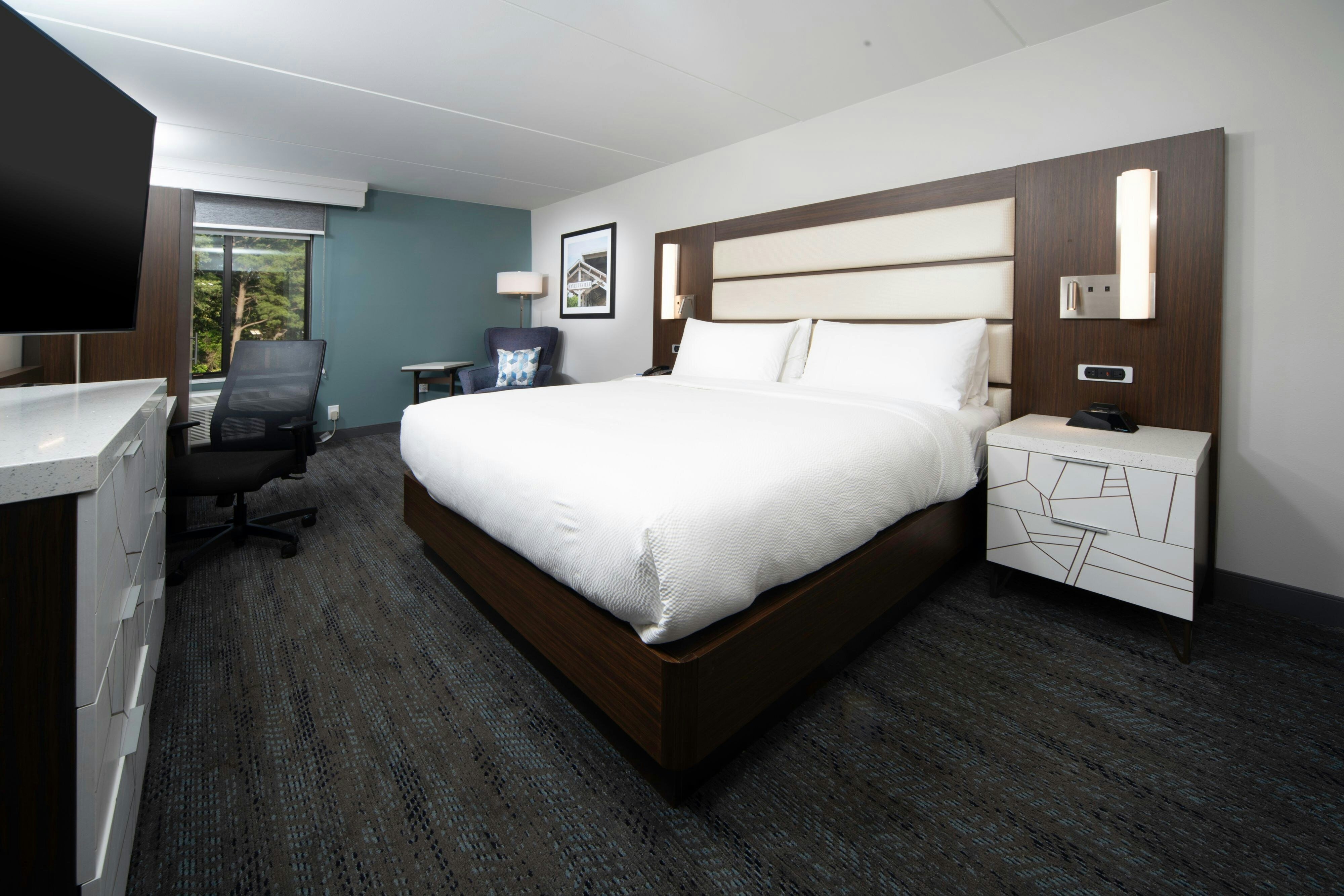 Four Points by Sheraton Fayetteville Fort Bragg-guestroom-King room with chair and ottoman.jpg
