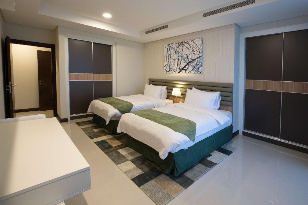GULF EXECUTIVE RESIDENCE - JUFFAIR-guestroom-Three Bedroom.jpg