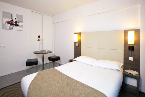 Studio - Double bed and cupboard