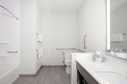 Refresh in front of a lighted vanity in our spacious bathrooms.