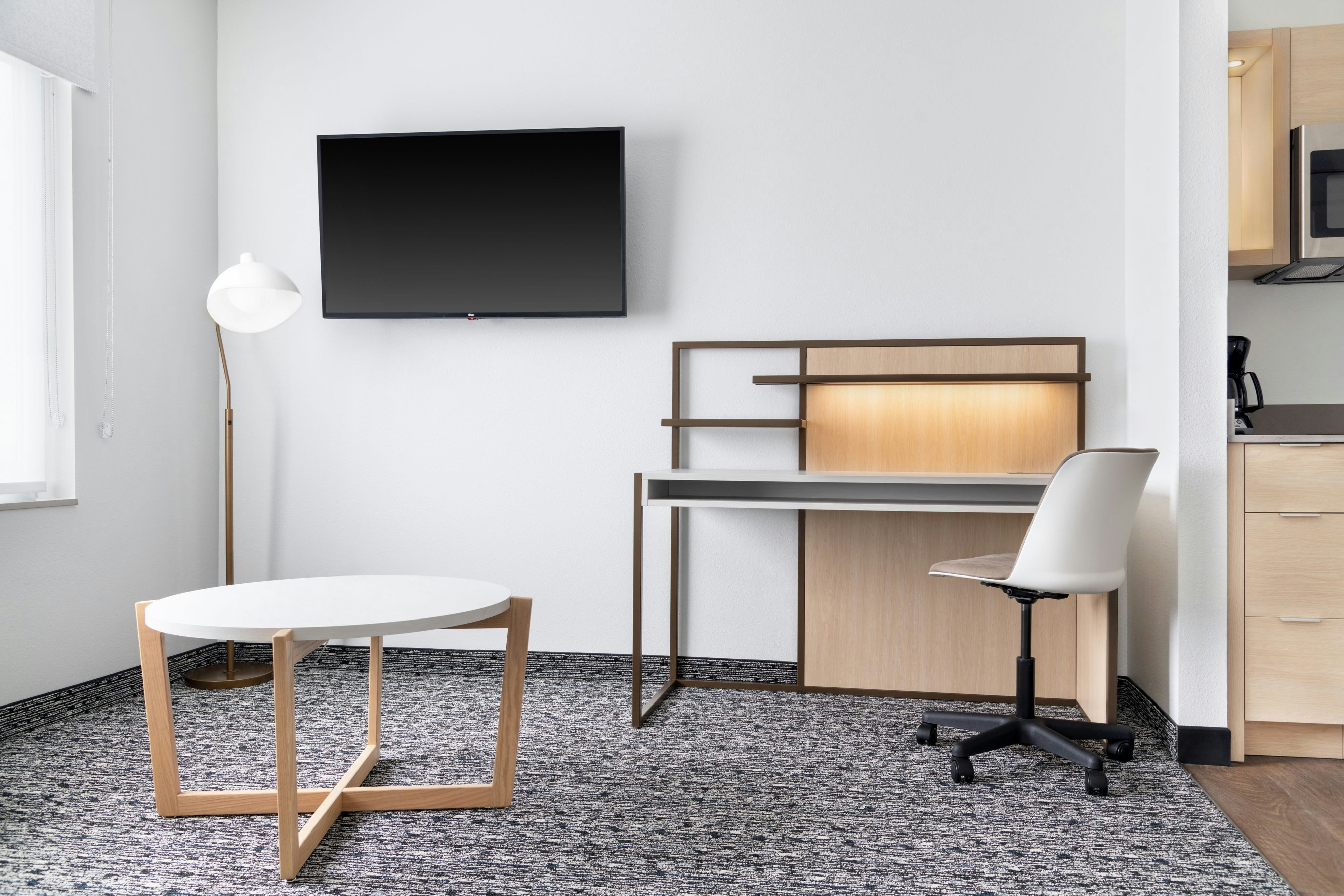 TownePlace Suites by Marriott Holland-guestroom-One bedroom suite desk.jpg