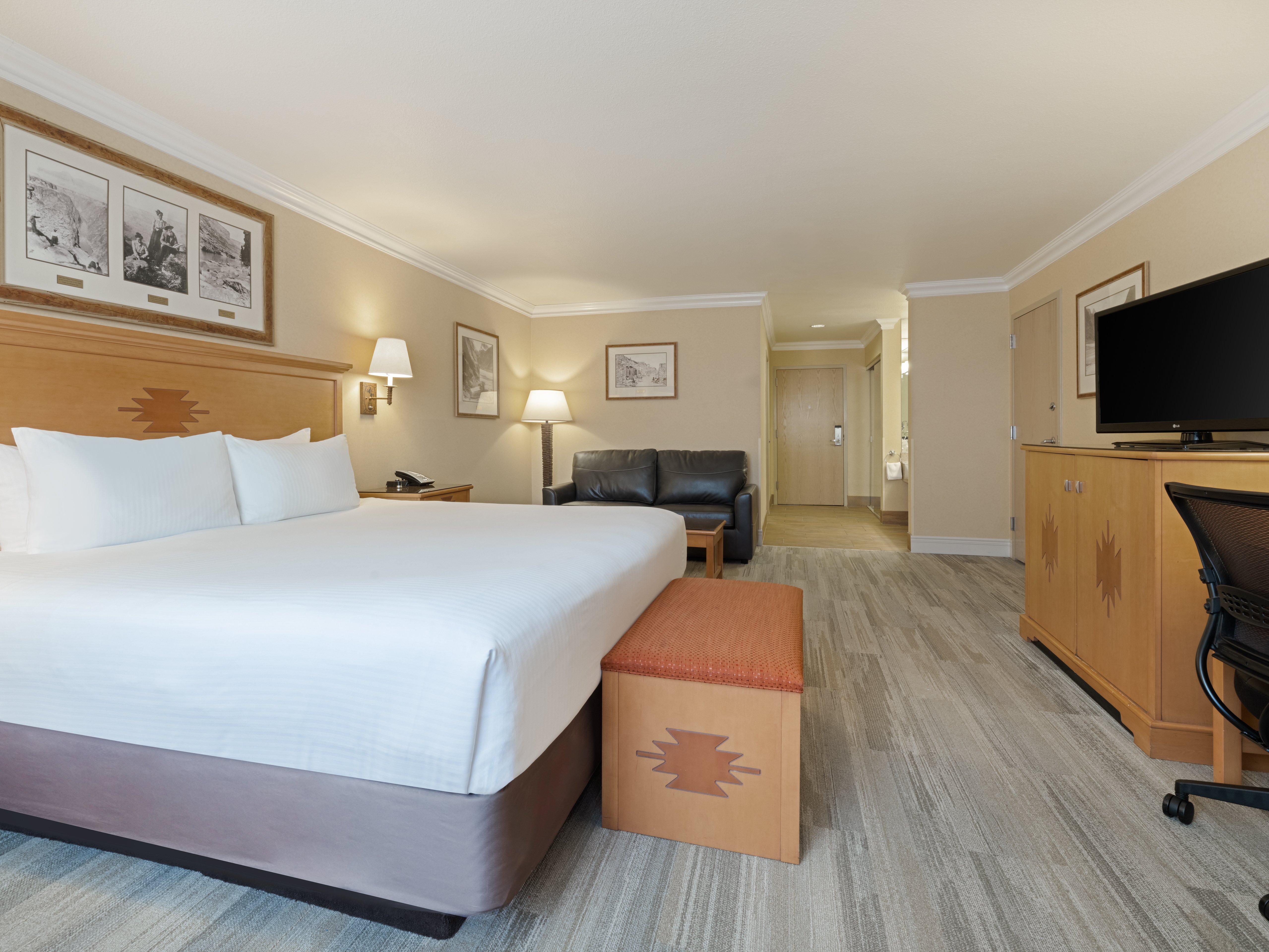 HOLIDAY INN RESORT SQUIRE GRAND CAN-guestroom-Your perfect stay awaits with our king bed room with a sofa bed..jpg