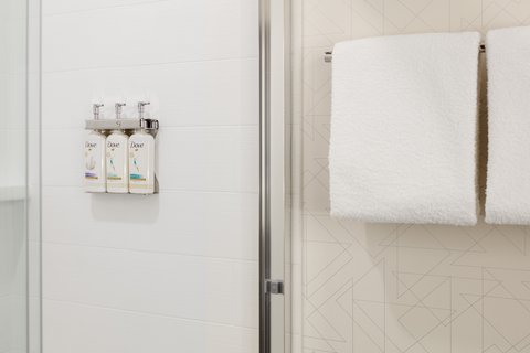 Our well-lit guest bathroom has a spacious walk in shower.