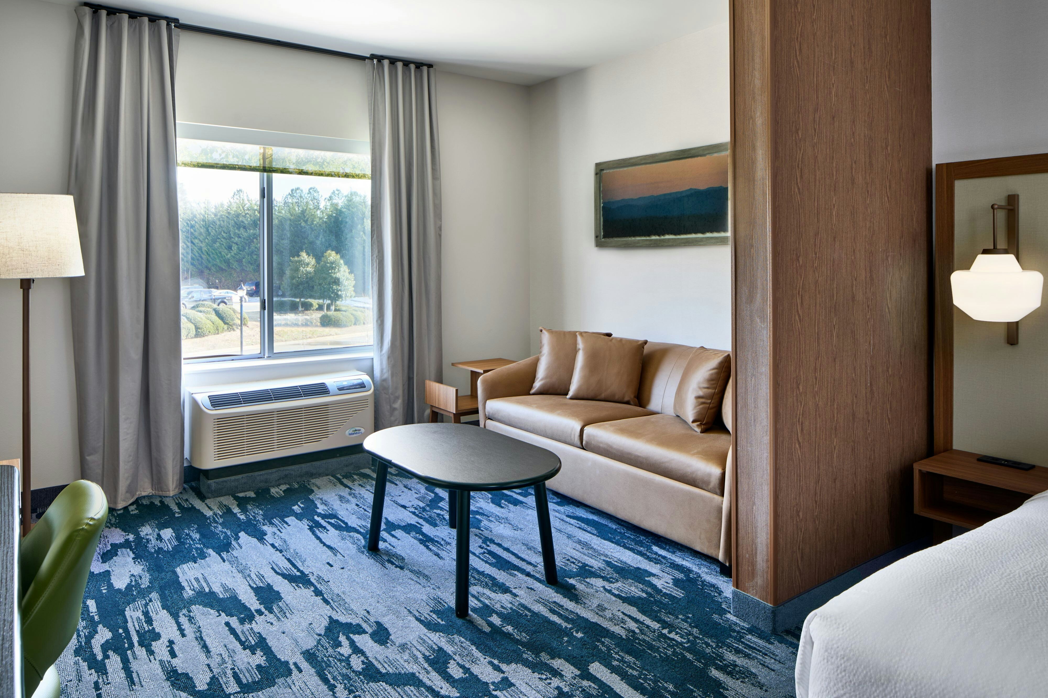 Fairfield by Marriott Inn and Suites Cornelia-guestroom-King Suite - Seating Area.jpg