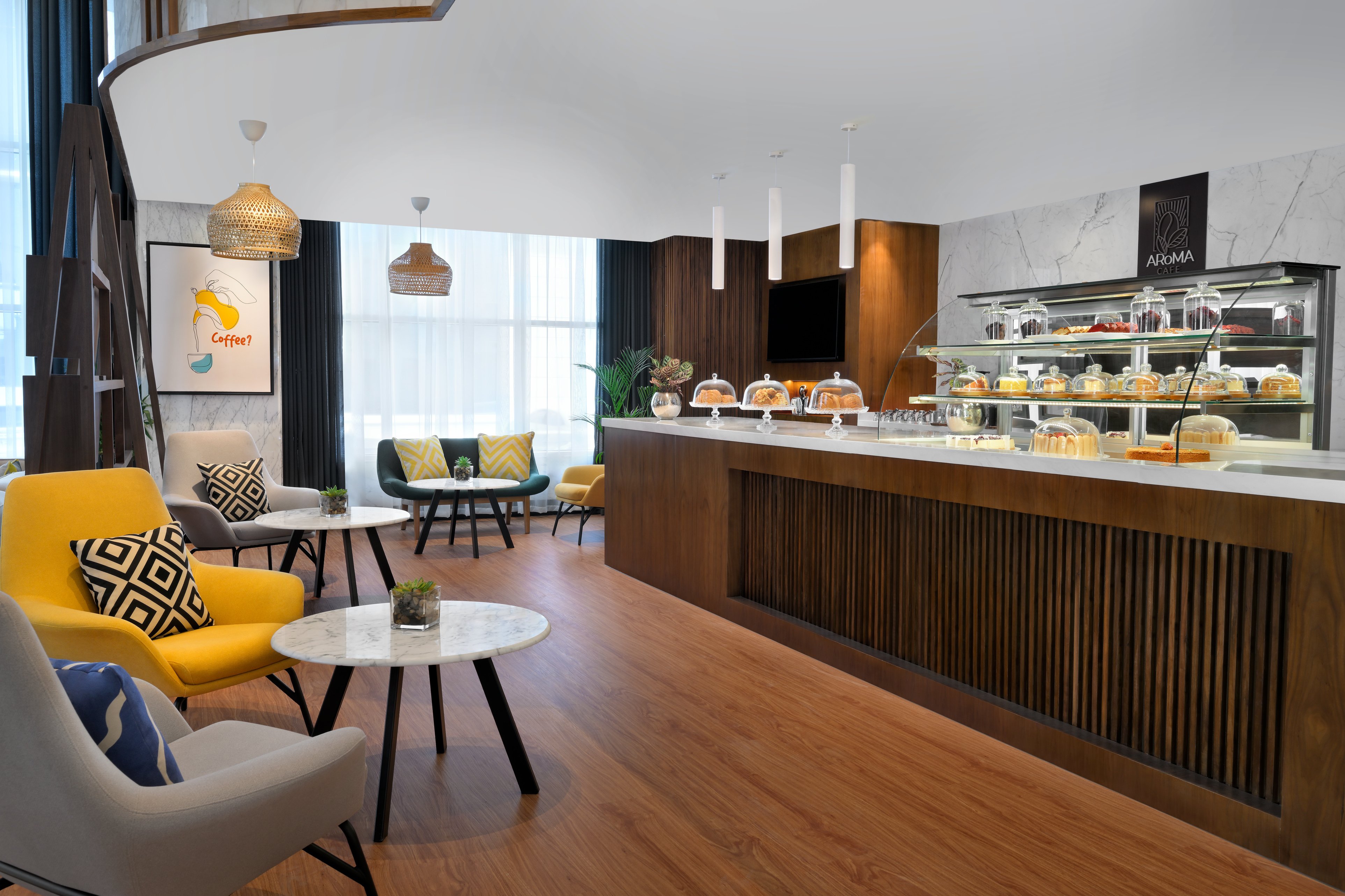 HOLIDAY INN AI MALAZ BY IHG-guestroom-Settle into cozy sofas for a drink or grab a snack on-the-go.jpg