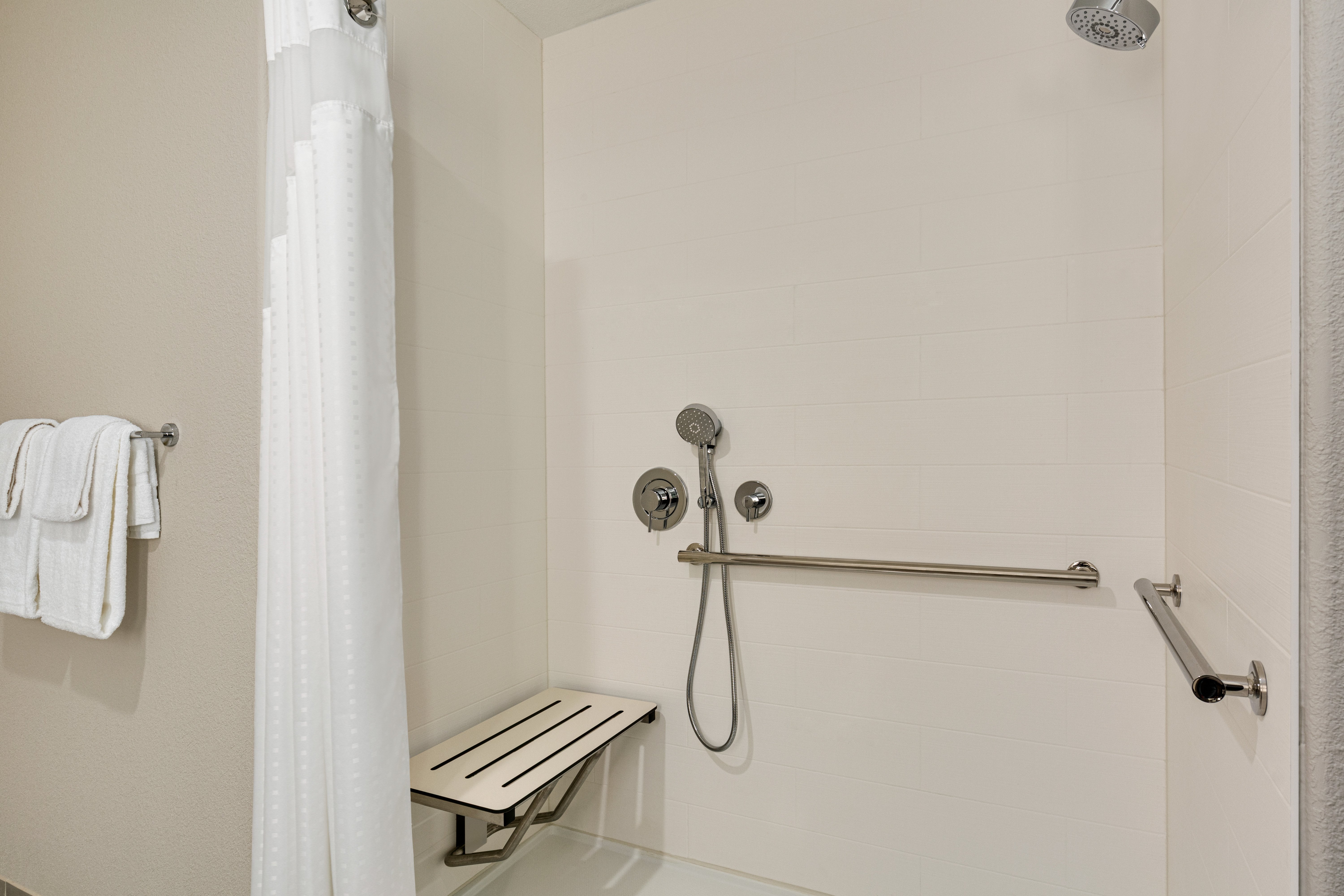HOLIDAY INN EXP STES HAYWARD BY IHG-guestroom-Mobility Accessible Roll In Shower.jpg